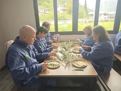 Travelers preparing bamboo during a panda conservation experience near Chengdu